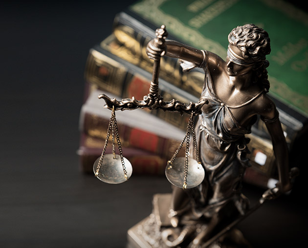 An image of a statue holding the scales of justice.